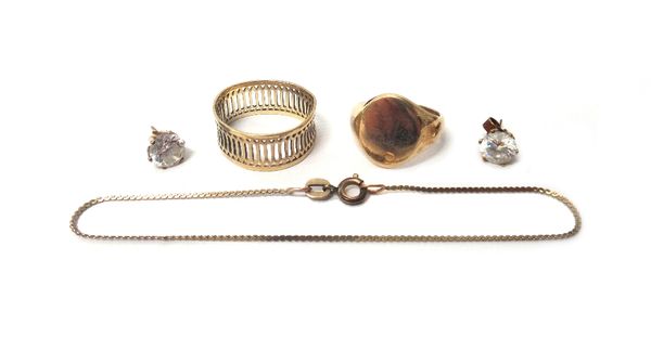 A 9ct gold oval plain signet ring, London 1979, ring size K and a half, a gold bracelet with a gilt metal clasp, a pair of gold and colourless gem set