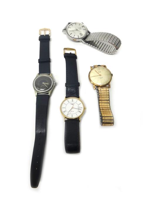 A Longines Quartz gold circular cased gentleman's wristwatch, the signed white dial with black Roman numerals and with a date of the month aperture, t