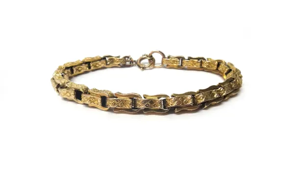 A gold twin link bracelet, with engraved decoration, on a gilt metal boltring clasp, gross weight 15.2 gms.
