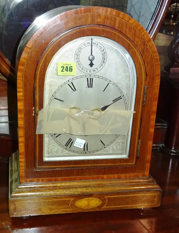 A 19th century mahogany eight day chiming mantel clock with arched top. C8