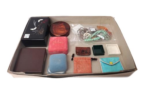 A jade circular pendant, with a gold neckchain, on a boltring clasp, detailed 9 CT, two pendants with neckchains, a reconstituted amber pendant, two f