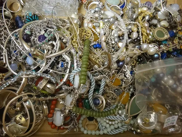 A large collection of mostly silver mounted jewellery, including necklaces, rings, bangles, earrings and further items, also a silver lidded oval glas