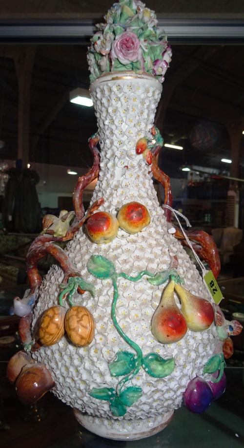 A German Schneeballen type vase and cover, late 19th/early 20th century, decorated all over with applied flower heads, fruiting vines and exotic birds