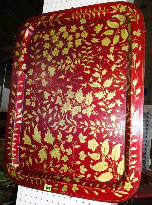 An early 20th century red lacquer papier mache tray painted with gold leaves, 76cm wide. 7.13    H6