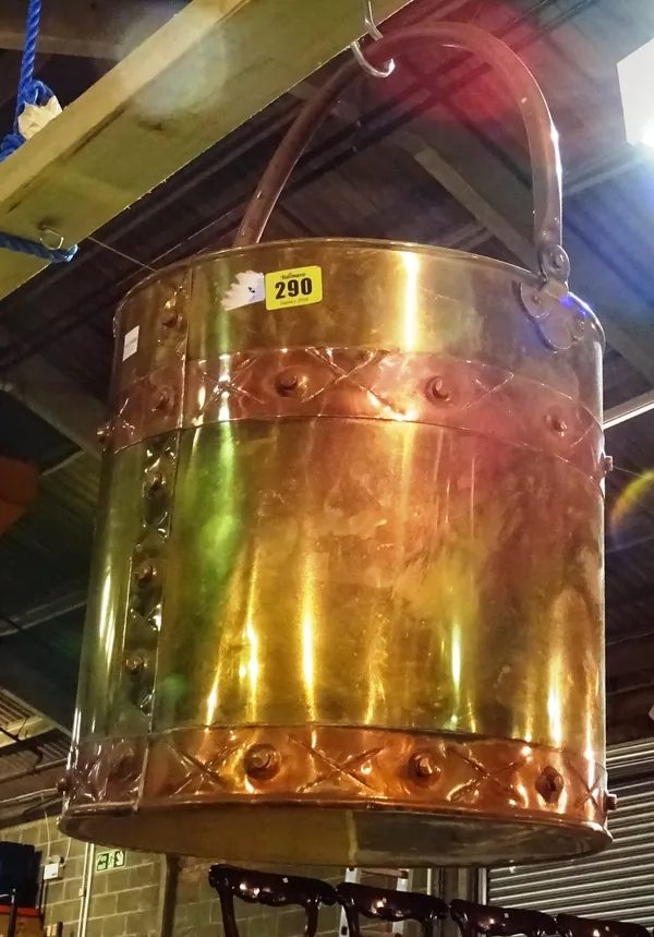 A 20th century brass and copper banded fire bucket.   HANGING J5