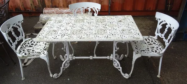 Three white painted garden chairs and a similar garden table, (4).OUT