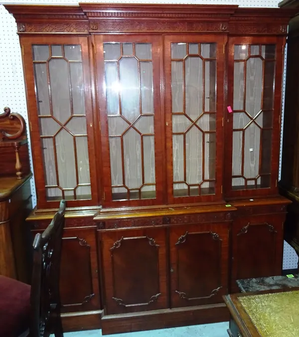 A 20th century mahogany breakfront bookcase of Chippendale style, 167cm wide x 200cm high.  F11