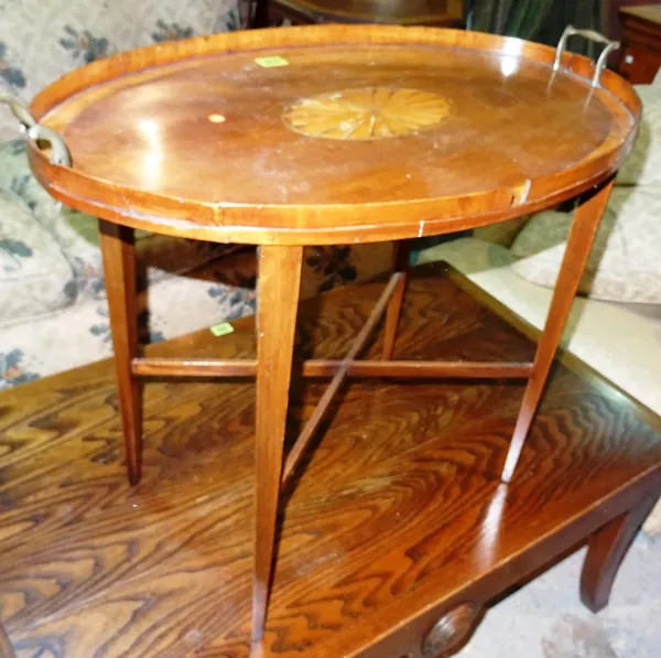 An Edwardian mahogany and satinwood inlaid oval tray table, (a.f.) 68cm wide x 54cm high.  E5