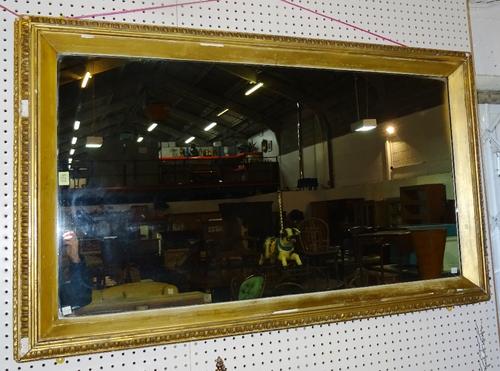 An early 20th century gilt rectangular mirror, 82cm wide x 132cm high.   A6