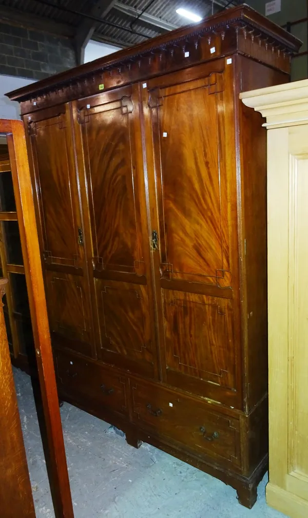 A 20th century Gothic style mahogany double wardrobe, 136cm wide x 181cm high.   M8