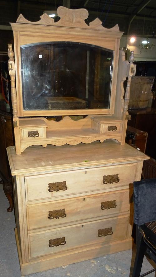 A 20th century pine chest of drawers, with three long drawers and dressing mirror top, 92cm wide x 189cm high.  M10