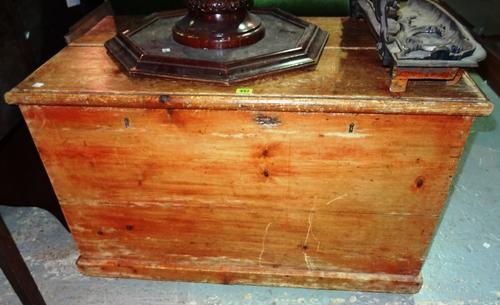 An early 20th century pine lift top trunk, 95cm wide x 58cm high.  F3