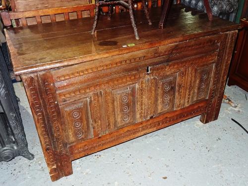 An early 17th century Dutch carved oak coffer, 123cm wide x 74cm high.   I6