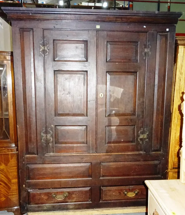 An early 20th century oak estate cupboard, 157cm wide x 198cm high.   M10