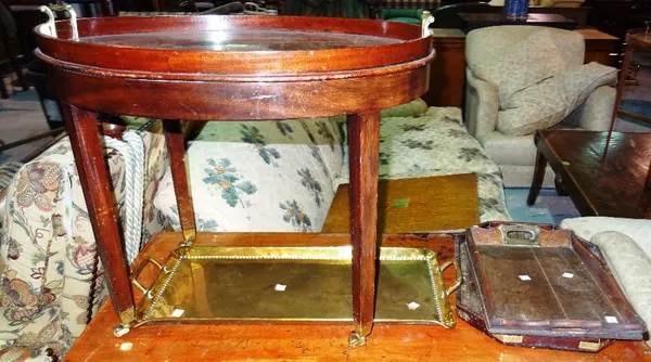 A 19th century mahogany and brass twin handled tray on stand, together with a group of four wooden and brass trays, (5).   D4