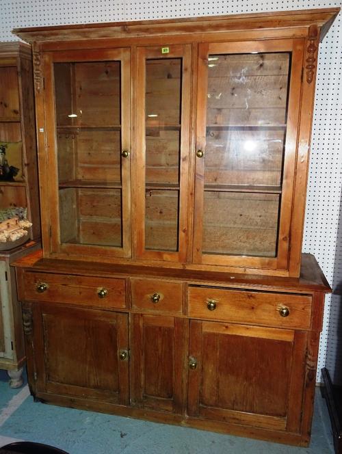 An early 20th century stripped pine kitchen dresser, with associated top, 158cm wide x 201cm high,   K11