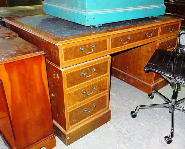 A 20th century yew pedestal desk, 152cm wide x 70cm high.  F10