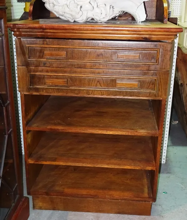 An early 20th century oak clerk's desk with two long drawers, 79cm wide x 131cm high.   A10