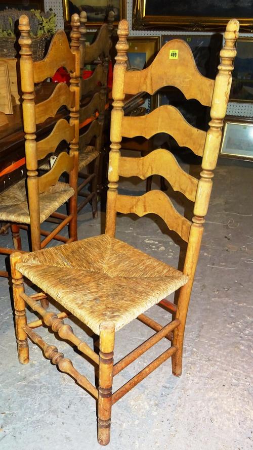 A set of six 20th century stained beech ladder back armchairs, (6).K2