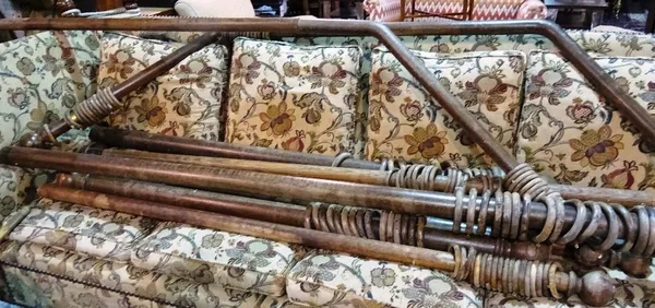 A group of early 20th century oak curtain poles of various sizes, including a bay window pole, (qty).   ROST