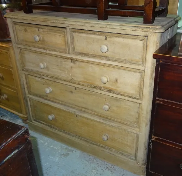 An early 20th century pine chest of drawers, with two short and three long drawers, with bun handles, 117cm wide x 106cm high.J8