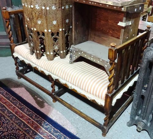 A mid-20th century oak framed square back sofa, with barleytwist supports, 122cm wide.   J6