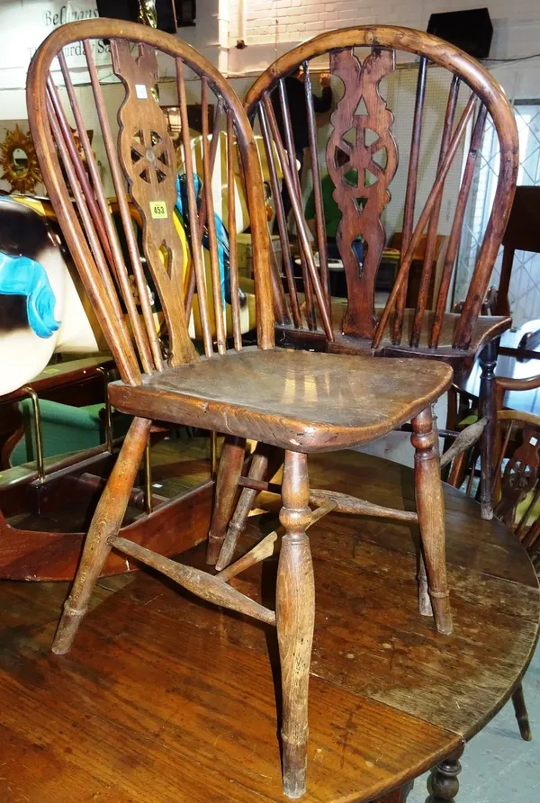A set of six 19th century ash and elm wheel back dining chairs, (6).   F9
