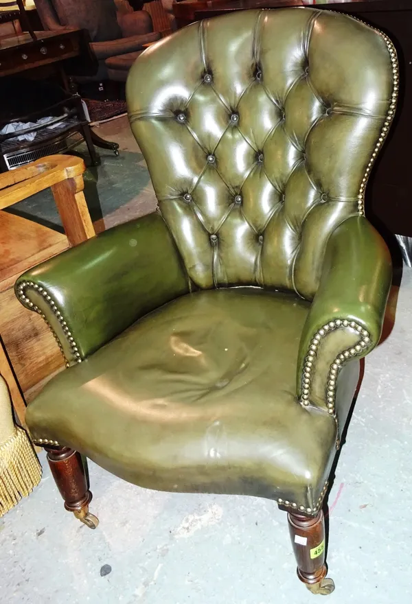 A 20th century mahogany framed nursing chair, with green studded leather upholstery.   D8