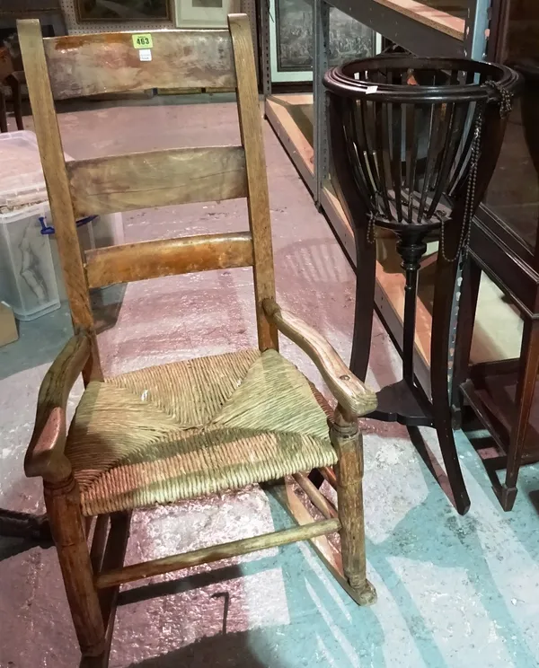 An Edwardian mahogany jardiniere and a 19th century ladder back rocking chair, (2).   J4