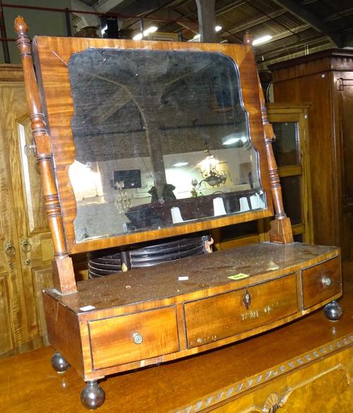 A Victorian mahogany bowfront dressing mirror, with three drawer base, 58cm wide, together with a mahogany triptych mirror, 60cm wide, (2).  K9