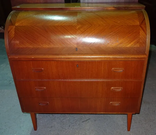A mid-20th century teak roll top desk, with three long drawers, on square tapering supports, 90cm wide x 97cm high.   J7