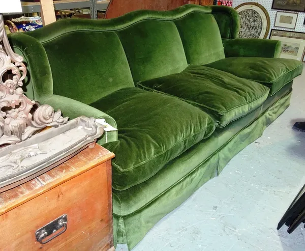 A large 20th century green velvet upholstered three seat sofa, 225cm wide. E3