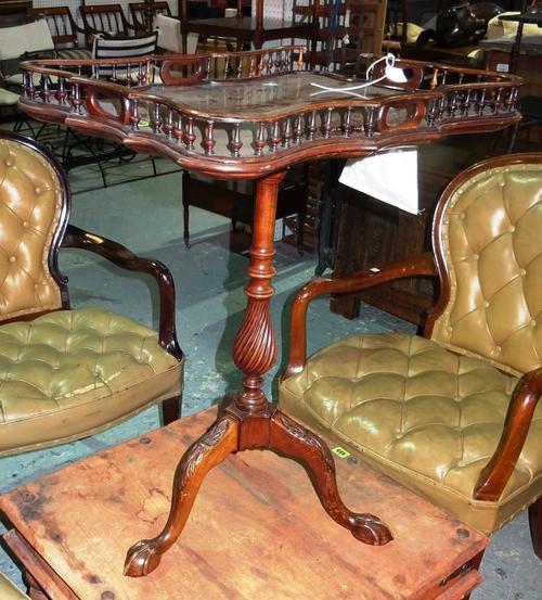 A George III style mahogany tripod table, the top of galleried serpentine form over an associated spiral turned base, 54cm wide.   I7