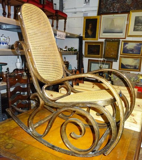 A 20th century Thonet style bentwood rocking chair with cane back and seat.   K3