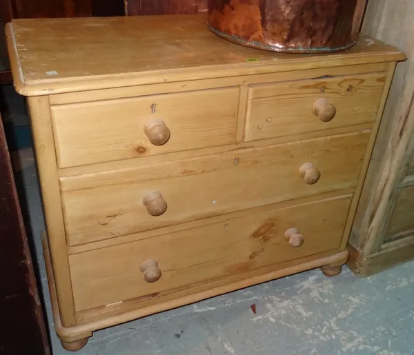 A 20th century pine chest of two short and two long drawers.  J9
