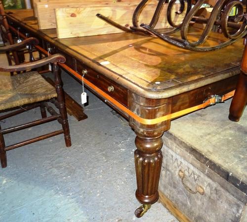 A large Victorian mahogany writing desk with leather inset top on turned bulbous supports, and four frieze drawers either side,  227cm wide x 80cm hig