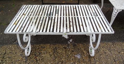 A 20th century cast iron rectangular garden table with marble inset top,  77cm wide x 62cm high and a white painted aluminium low table, 100cm wide x