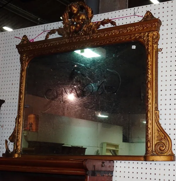 A 20th century gilt overmantel wall mirror with cherub and floral motif.  M6