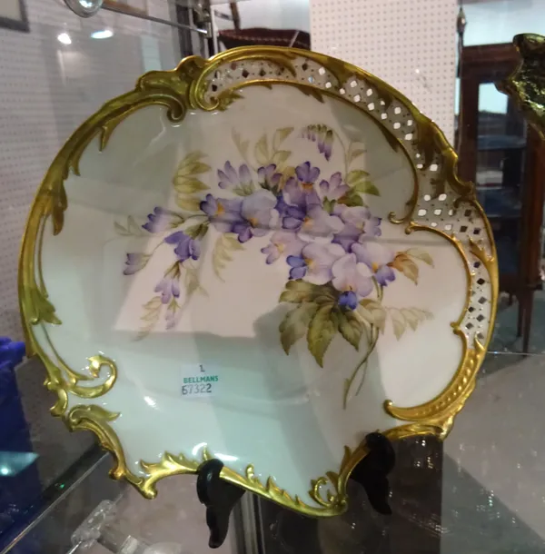 A Royal Worcester plate, circa 1900, with blue flowers and gilt border, 20cm wide.  CAB