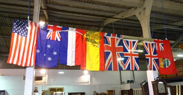 Flags, comprising; 20th century, three 'Union Jacks', one USA flag, an Australian flag and three further, (8).  HANG