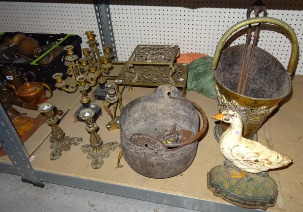 Metalware collectables, including; a brass trivet, an embossed brass coal bin with swing over handle, a cast iron door stop formed as a duck, two pair