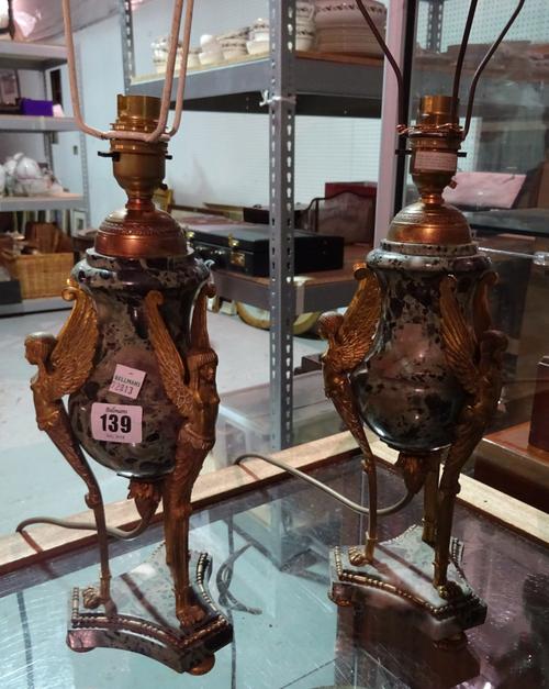 A pair of early 20th century green marble urn shaped table lamps with figural gilt metal supports.   CAB