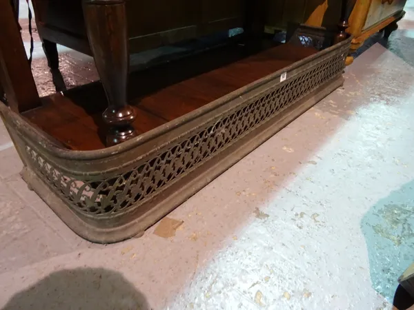 A 19th century fire curb with scrolling decoration, 130cm wide.  L8