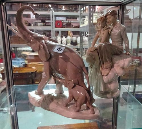 Ceramics, including; a large Lladro figure of an elephant and child and a Lladro figure depicting seated lovers, (2).   CAB