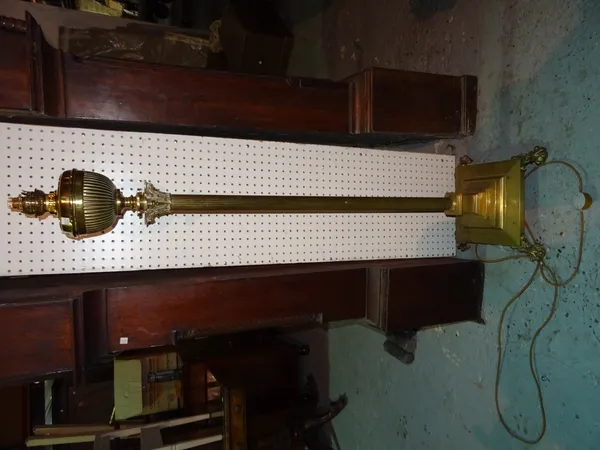 A 19th century gilt brass corinthian column oil lamp, converted to electricity with square base and lion paw feet, 160cm wide.  K5