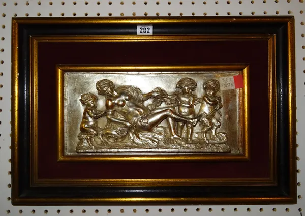 A silvered copper plaque depicting a reclining female figure surrounded by putto and fawns, framed, overall size 55cm x 37cm.  ROST
