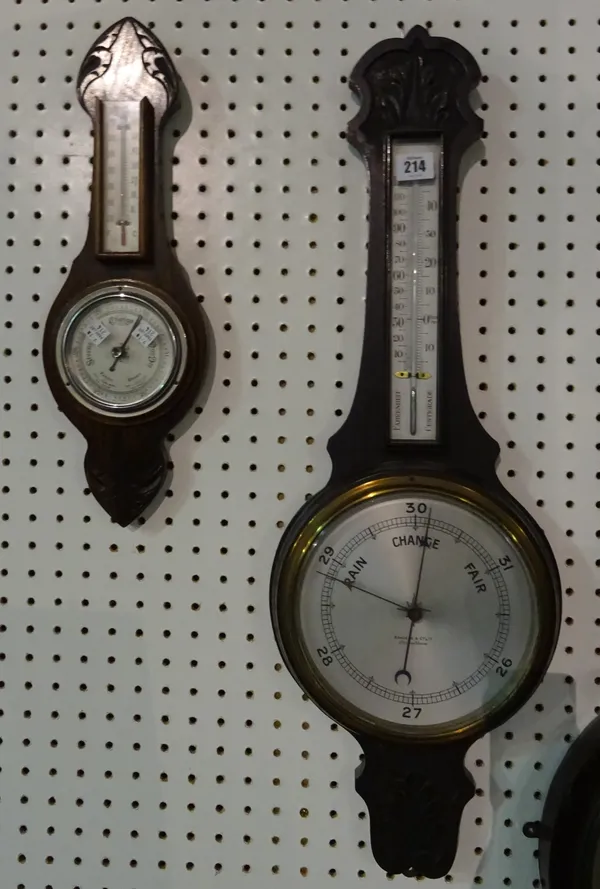 A 20th century oak wall barometer and another similar smaller, the largest 77cm high, (2).  CAB