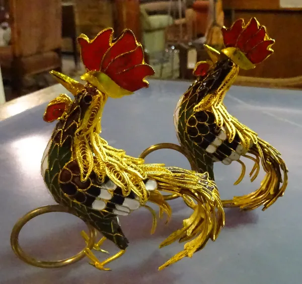 A quantity of gilt metal and enamel napkin rings formed as cockerels. CAB