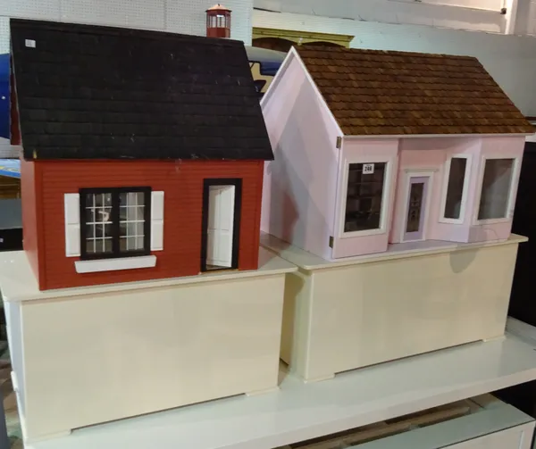 Toys, comprising; a 20th century doll's house painted pink with bay window and a smaller red doll's house, (2).  F8  F8