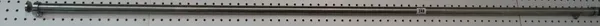 A 20th century brushed steel curtain pole with fixings, 180cm long.   CAB